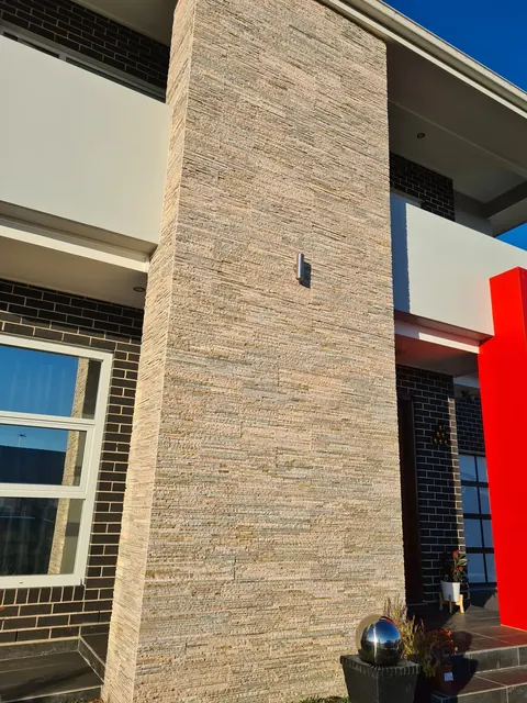 Stacked stone cladding on an exterior column