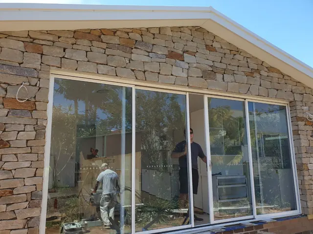 Stone cladding on an exterior wall around new windows