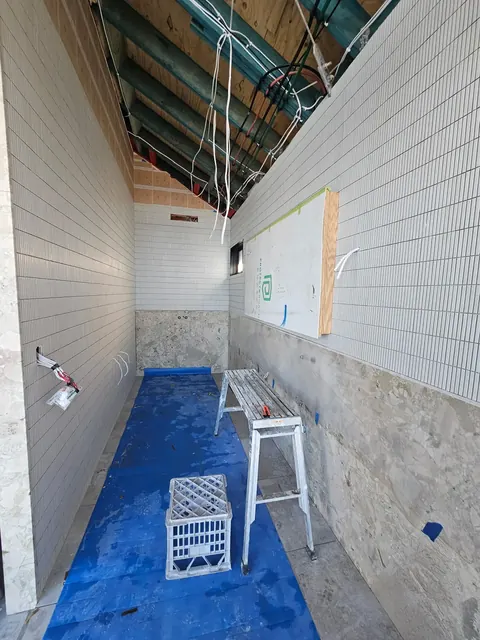 Wall tiling and a stone base in an alfresco area under construction