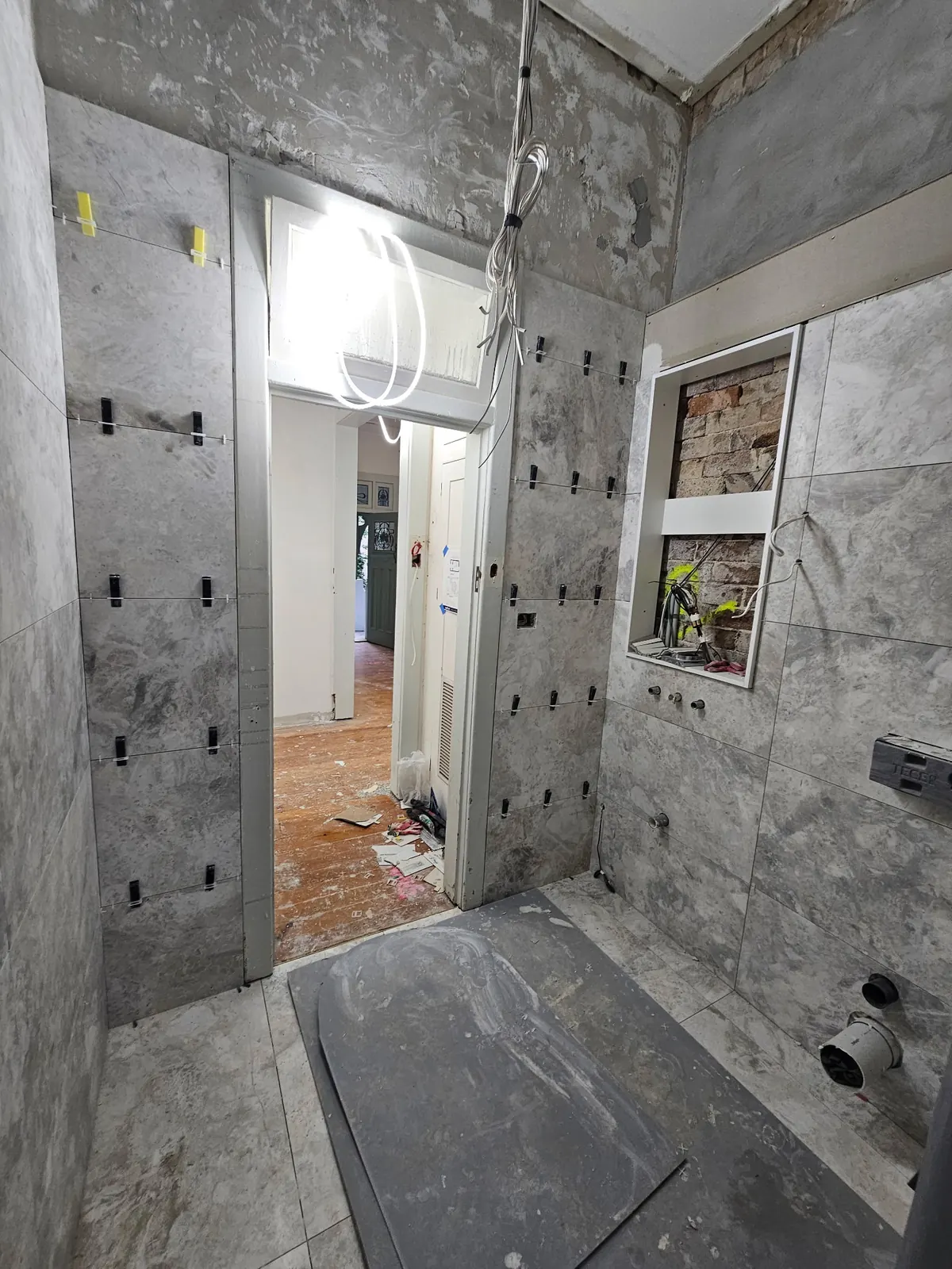 Bathroom stripped back and re-tiled